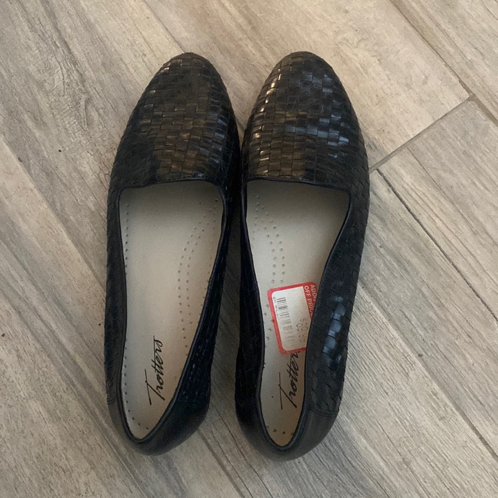 Black woven leather loafers